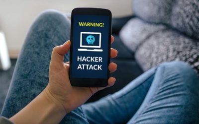 Person Holding Mobile Phone With Hacker Attack Warning